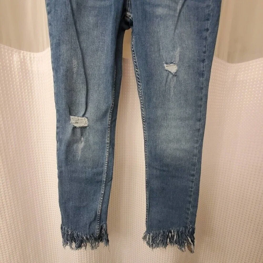 Free People light wash distressed diagonal raw‎ hem jeans size 30 new!!!